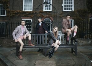 photography of group of people sitting on bench